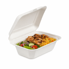 7x5 bagasse hinged lunch box filled with grilled chicken, vegetable rice and fresh salad on a white background.