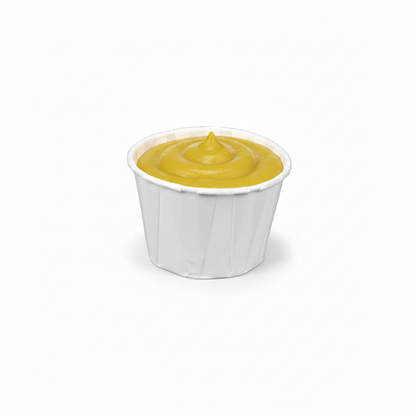 Food Packaging Direct 1oz white paper souffle cup filled with yellow mustard, featuring a rolled rim and pleated sides.