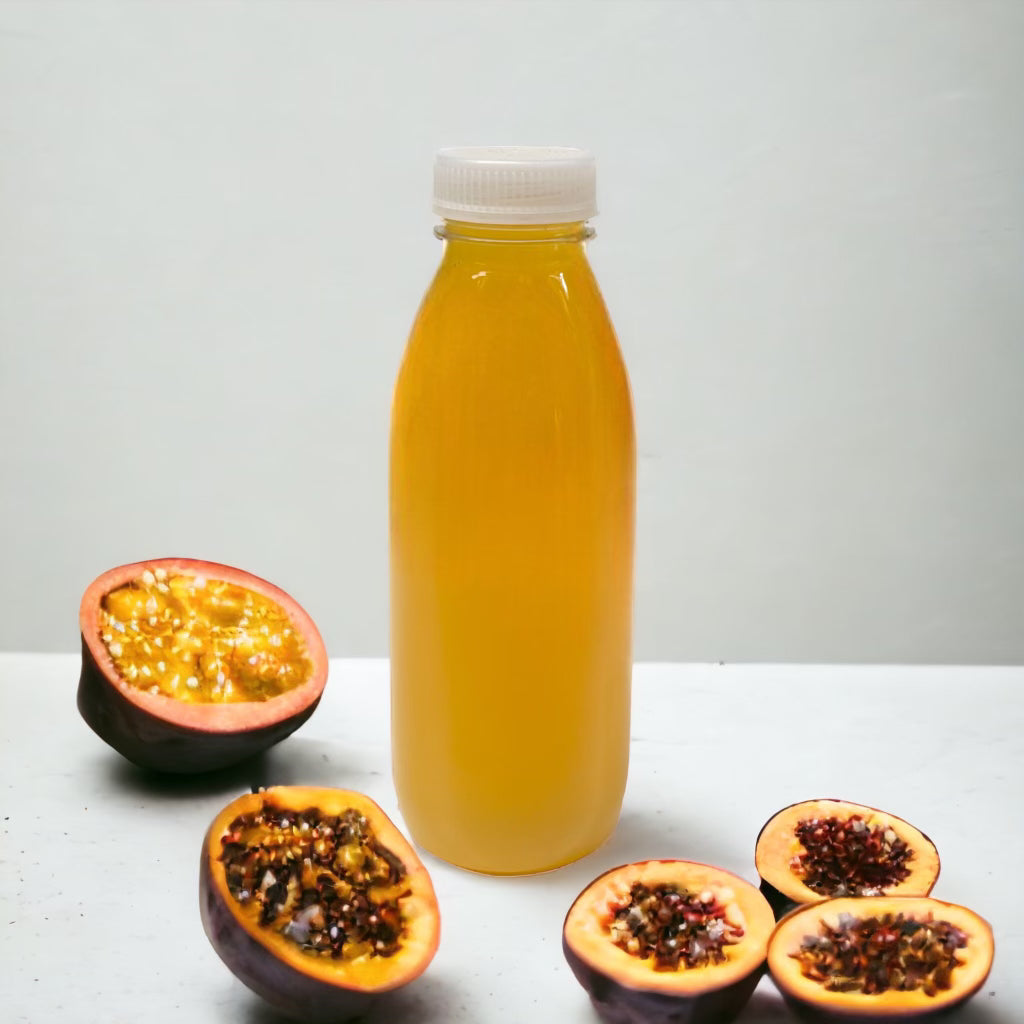 Food Packaging Direct 500ml clear PET plastic bottle filled with yellow juice, surrounded by halved passion fruit.