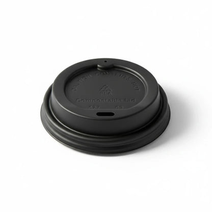 Food Packaging Direct compostable black sip-thru lid for hot takeaway coffee cups on a white background.