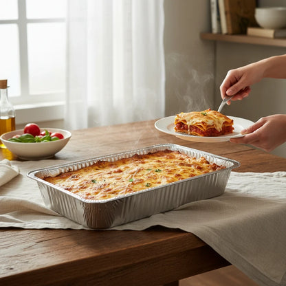 Food Packaging Direct full deep rectangular aluminium foil container filled with steaming hot baked lasagna