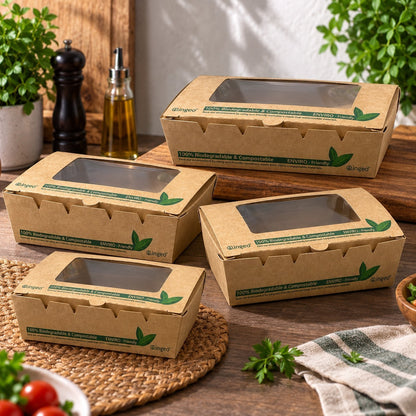 Food Packaging Direct compostable kraft salad boxes with clear PLA windows in four different sizes on a wooden table.
