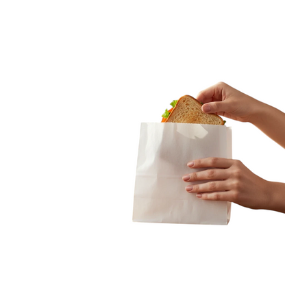 Food Packaging Direct white greaseproof paper bag holding a fresh sandwich on a wooden kitchen table