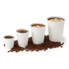 Food Packaging Direct white single wall paper coffee cups in four different sizes filled with hot drinks on coffee beans