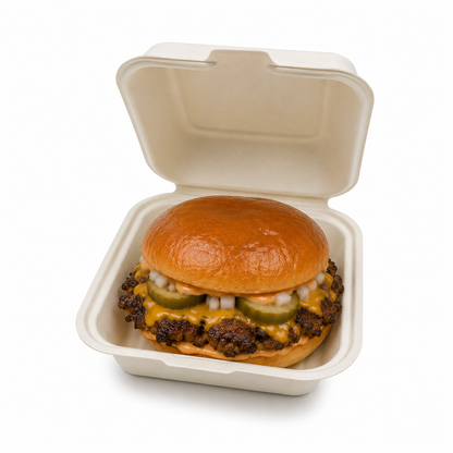 HP7 5-inch bagasse burger box filled with a smashed cheeseburger, pickles, onions and melted cheese on a white background.